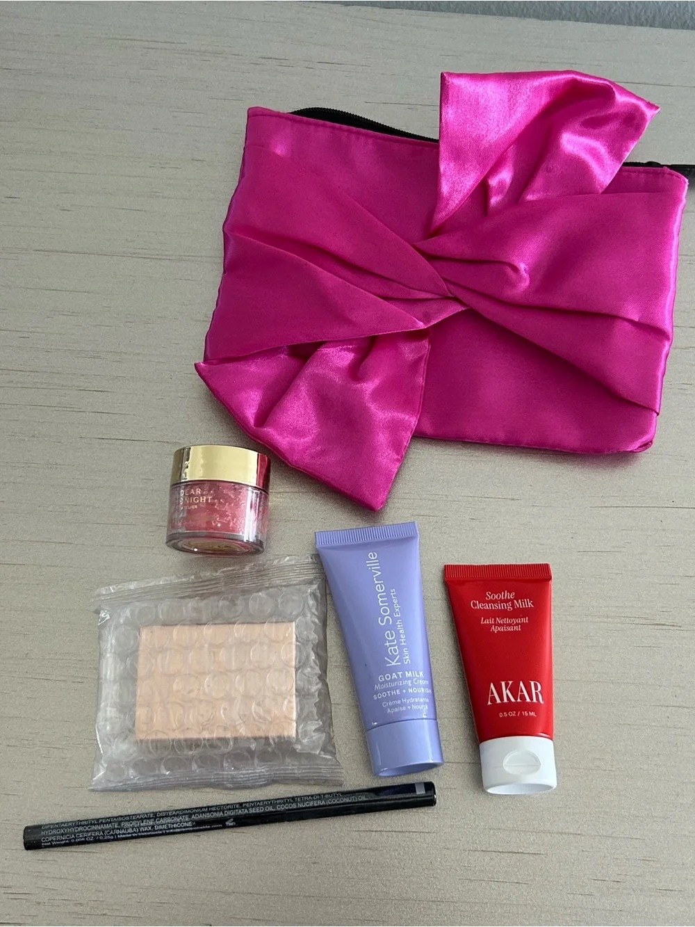 5 Premium Skincare Beauty Products in a satin Fuchsia Pouch
